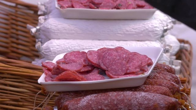Sliced Spanish Chorizo sausage on a market stall filmed at a Food Festival in England