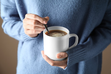 Woman with cup of tasty cocoa, closeup