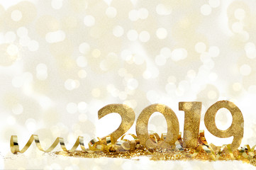 golden figures for new year 2019 on blur lights background