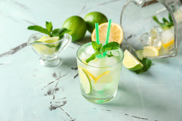 Glass of fresh mojito on light table