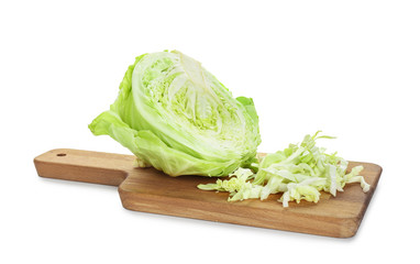 Wooden board with cut cabbage on white background