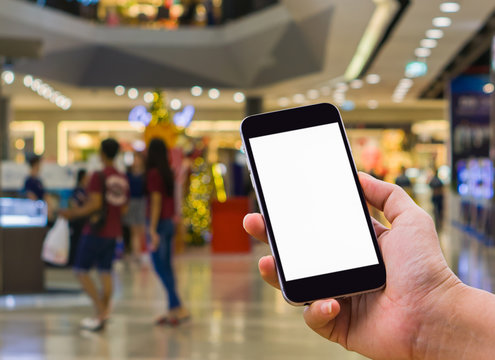Image of hand woman holding mobile phone with blank white screen for your text message.