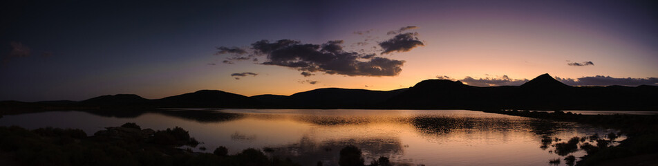 Scenic panoramic sunset over lake