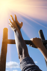 Hands holding ladder on blue sky background, with instagram style filter