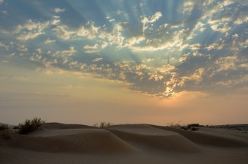 Namibia desert sunset with streaks and clouds