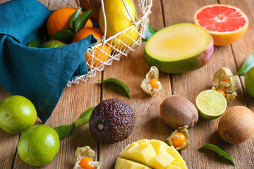 Various delicious exotic fruits on wooden table