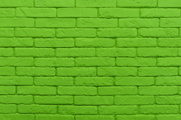 green brick wall painted at saturated lime colour. texture