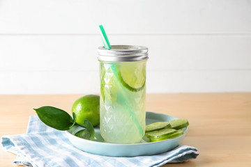 Jar of fresh lime lemonade on plate