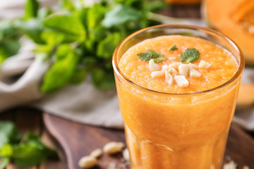 Glass of tasty melon smoothie, closeup