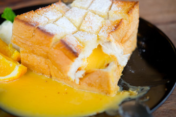 Toast topped with orange sauce butter and honey