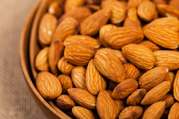 Almonds Nuts in the Bowl Background. Selective focus.