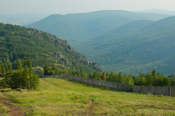 Naklejka premium Summer green mountains and forest landscape. Travel concept