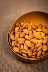 Almonds Nuts in the Bowl Background. Selective focus.