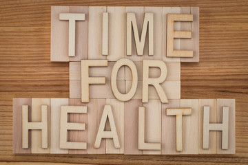 time for health -  text in vintage letters on wooden blocks. Medicine concept