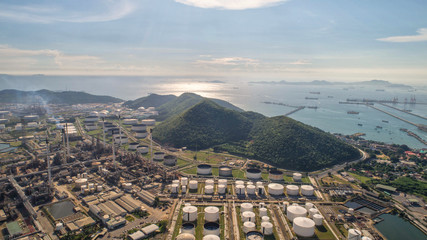 Industrial view at oil refinery plant form industry zone with sunrise and cloudy sky.Oil refinery...