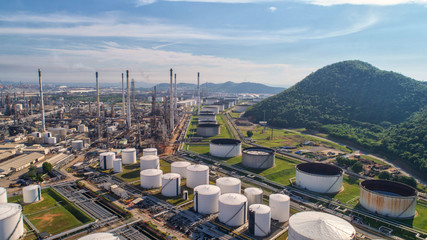 Industrial view at oil refinery plant form industry zone with sunrise and cloudy sky.Oil refinery...