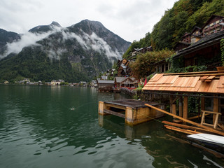 Fototapeta premium Foggy summer scene of Hallstatt lake. Splendid morning view of Hallstatt village, in Austria's mountainous Salzkammergut region, Austria. August, 2018