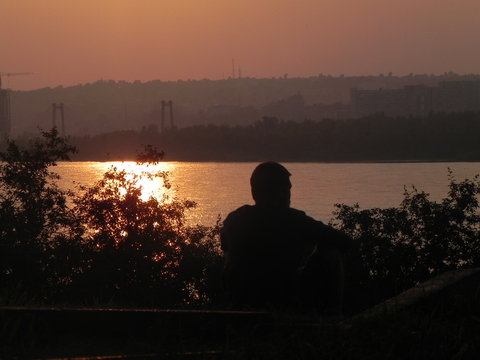 silhouette of woman at sunset