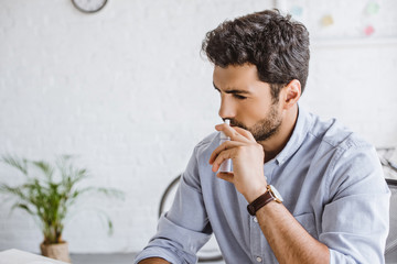 sick manager using nasal spray in office