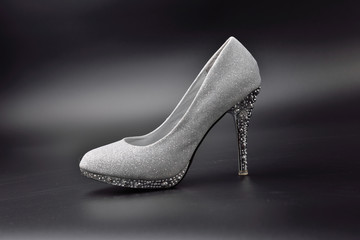 high heel shoes on black background