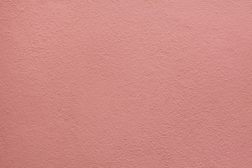Fototapeta premium Pink painted stucco wall. Background texture
