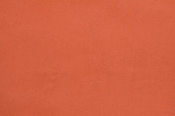Orange painted stucco wall. Background texture