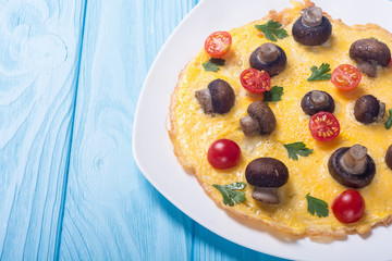 Omelette with mushroom , tomato and parsley