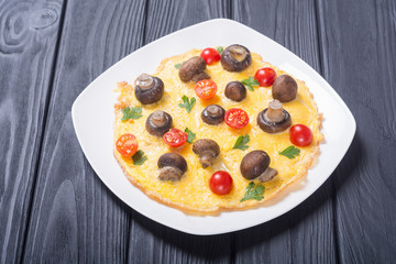 Omelette with mushroom , tomato and parsley