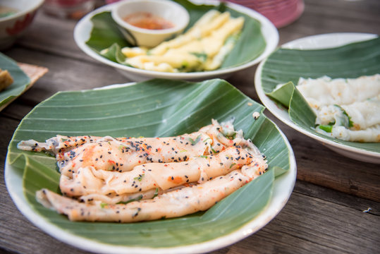 Thai food recipe name is "Khao parn pak", a egg steaming and topping with vegetable and roll with spicy sauce, This recipe from Sukhothai province at Thailand