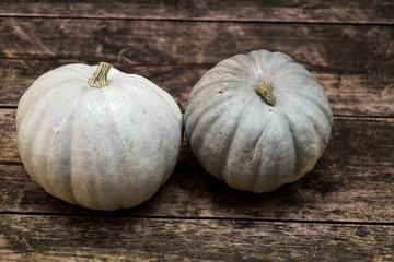 Pumpkins for Halloween on a wooden background