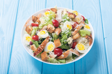 Salad ceasar with chicken , eggs and tomatoes