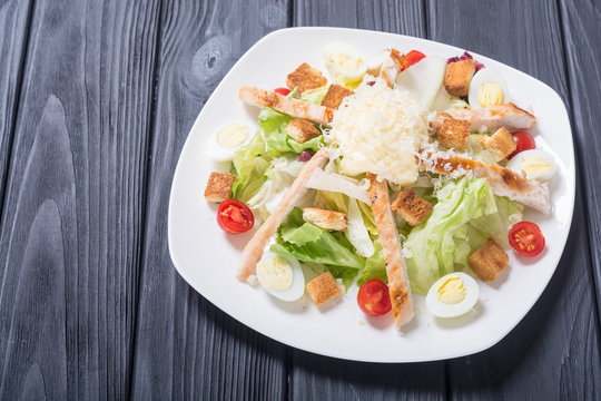 Salad ceasar with chicken , eggs and tomatoes