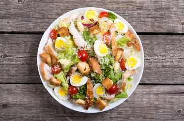 Salad ceasar with chicken , eggs and tomatoes