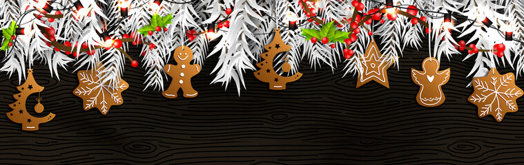 Christmas border (Weihnachten Girlande) with fir branches, pine cones, holly, and string lights. Merry Christmas background with open space for your text.