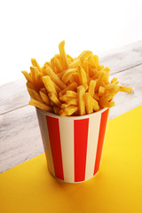 Potatoes French Fries in Red and white Carton Package Box. Fast Food.