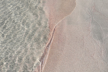 Fototapeta na wymiar Rose sand on the beach