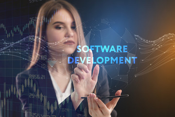 The concept of business, technology, the Internet and the network. A young entrepreneur working on a virtual screen of the future and sees the inscription: Software development