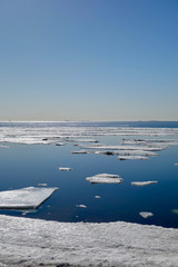 Cool morning with floating ice in the sea