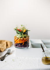 Salad in glass jar with chickpea