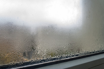 Condensation on the glass in the fall, when the apartment has not yet turned on central heating, and the street is cold.