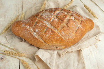 Bread with wheat, top view. The concept of a bakery and food store.