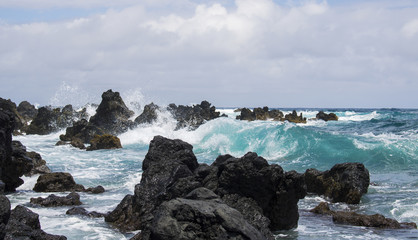 Fototapeta na wymiar Seascape Breaking Waves on Black Lava Rock