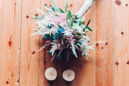 Bunch of flowers and candles with Mrs and Mr inscriptions