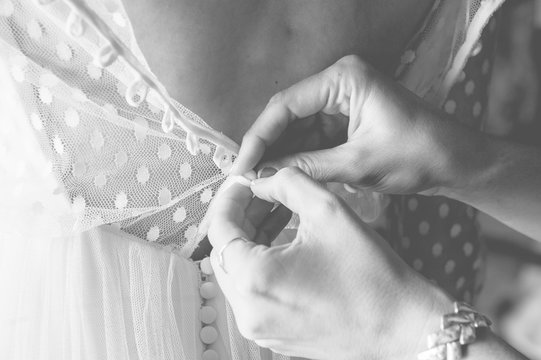 Woman in process of dressing up for event