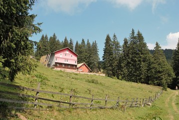 Mountain chalet with wooden fence