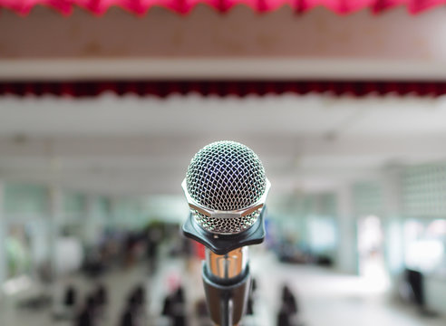 Microphone on Stage Against a Background of Auditorium.