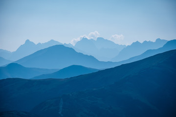 mountain top panorama in  autumn covered in mist or clouds