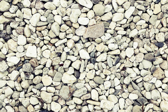 Light pabble stone wallpaper background with vintage - retro look, decolored, cold, sad and creepy stylization