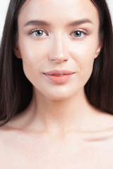 Young beautiful woman with clean perfect skin closeup