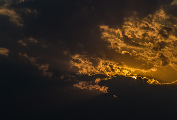 Sunset against the background of clouds